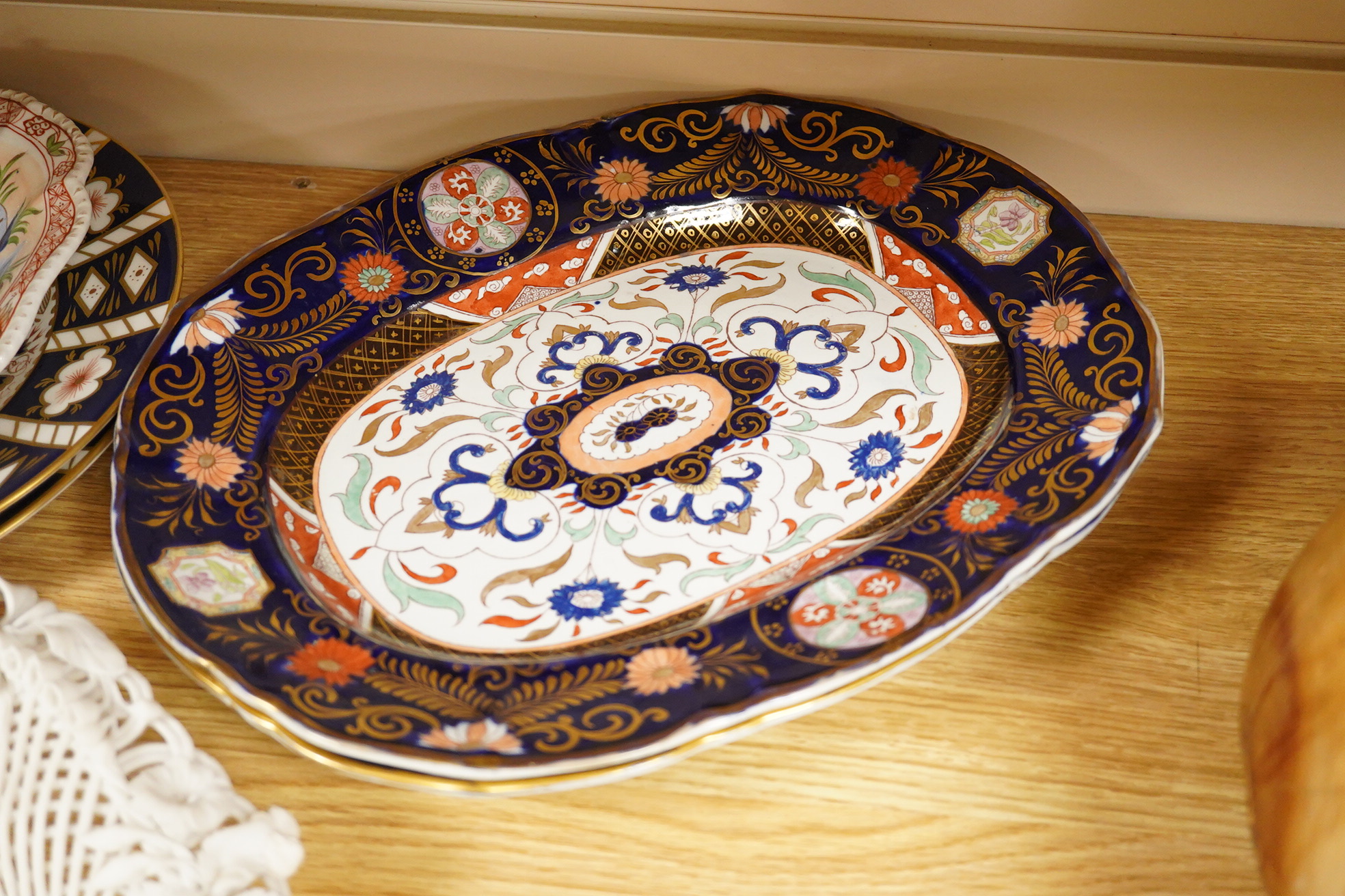 A Belleek porcelain basket, two Masons Ironstone dishes, a pair of Royal Crown Derby Japan pattern dishes and an ironstone leaf shaped dish (6).